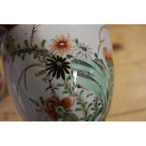 96 - A Chinese baluster vase with floral and insect decoration, 9 1/2