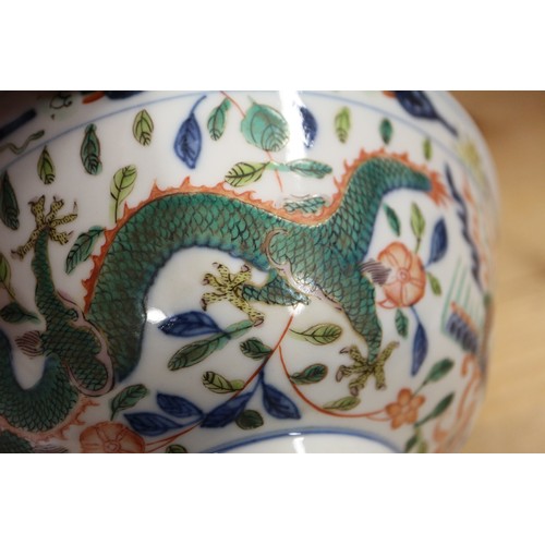 91 - A Chinese bowl with polychrome dragon, phoenix and leaf decoration, 6 1/4