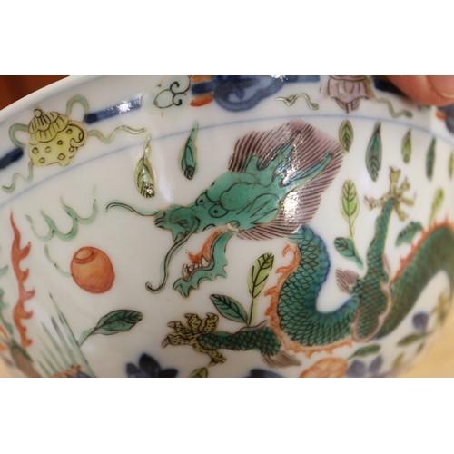 91 - A Chinese bowl with polychrome dragon, phoenix and leaf decoration, 6 1/4