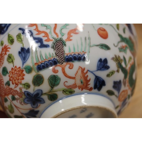 91 - A Chinese bowl with polychrome dragon, phoenix and leaf decoration, 6 1/4