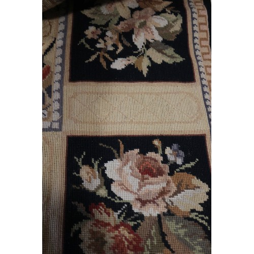 667 - An Aubusson type rug with floral panel designs, 72