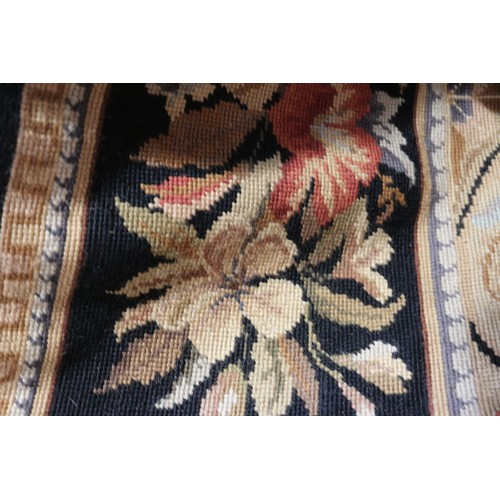 667 - An Aubusson type rug with floral panel designs, 72