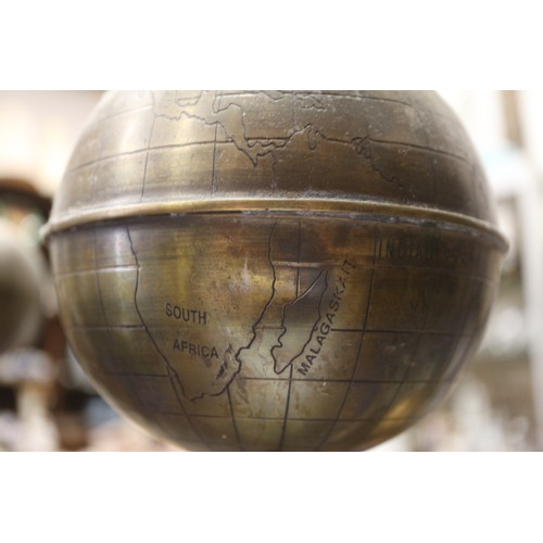 128 - A patinated brass hand-operated sun, earth and moon orrery, 18