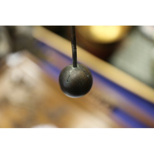 128 - A patinated brass hand-operated sun, earth and moon orrery, 18