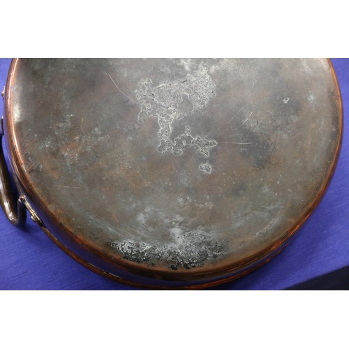 151 - A late 19th century copper two-handle preserve pan, 13