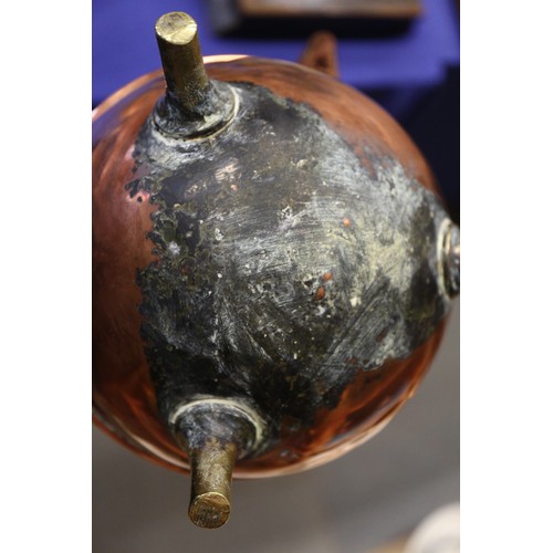 153 - A Benson style spherical copper kettle, on three feet, 9