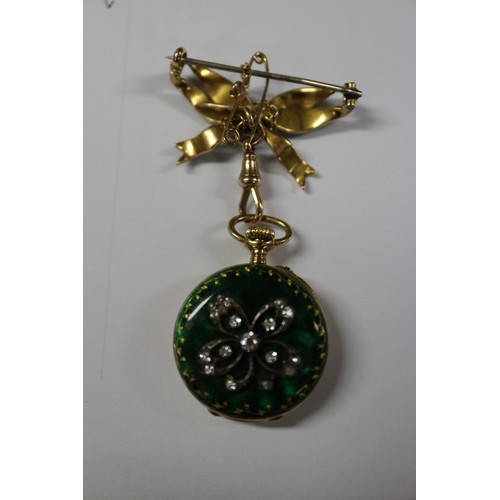 377 - A 19th century French yellow metal and enamelled pendant watch, on a bow brooch, by LeRoy and Fils, ... 