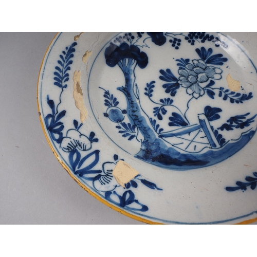 14 - An 18th century English Delft polychrome plate with fence design, 9