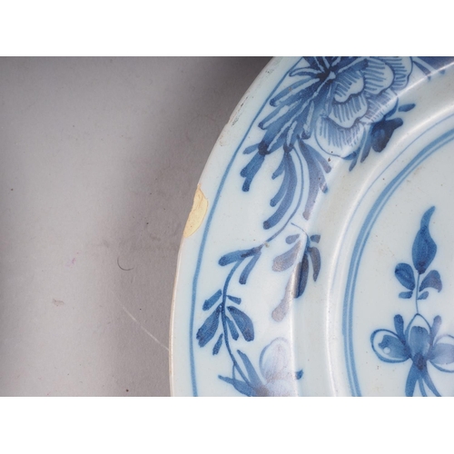 13 - A pair of early 18th century Bristol Delft floral decorated plates, 8 1/2