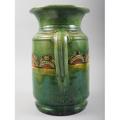 16 - A Ubeda sgraffito and slip decorated jug, 9 1/2