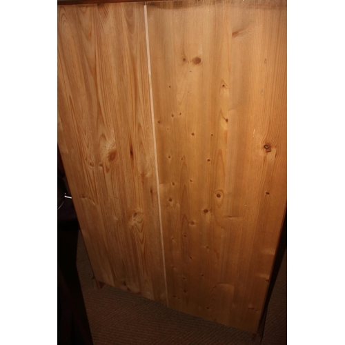 740 - A waxed pine cupboard, fitted adjustable shelves enclosed panelled door, on block base, 33