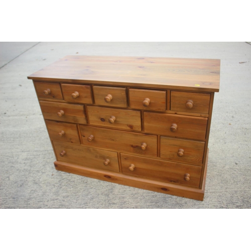 741 - A waxed pine chest of four small drawers, three short drawers over three further short drawers and t... 