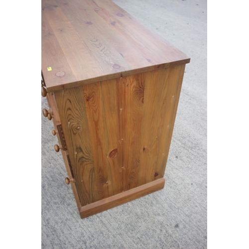 741 - A waxed pine chest of four small drawers, three short drawers over three further short drawers and t... 