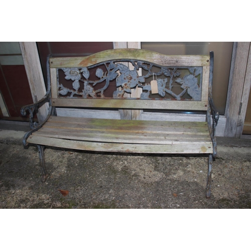 754 - A wrought iron framed bench with wooden slats 50