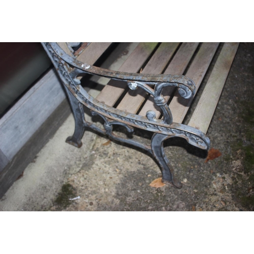 754 - A wrought iron framed bench with wooden slats 50