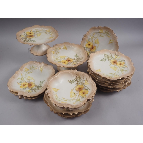 80 - A Limoges yellow poppy decorated dessert service for twelve, including two tazzas and four shaped di... 