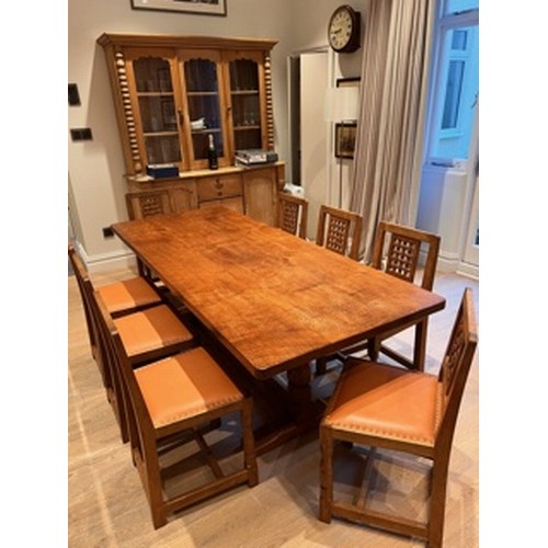 738 - A Mouseman Thompson adzed oak refectory table, on faceted pillar supports, 84