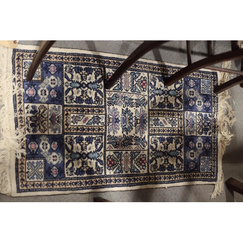 749 - A pair of Tunisian blue garden pattern rugs, 39