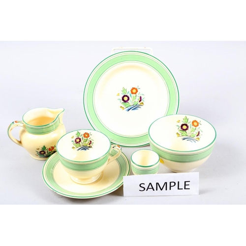 81 - A Mintons Art Deco part teaset with floral centres and green borders