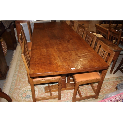 738 - A Mouseman Thompson adzed oak refectory table, on faceted pillar supports, 84