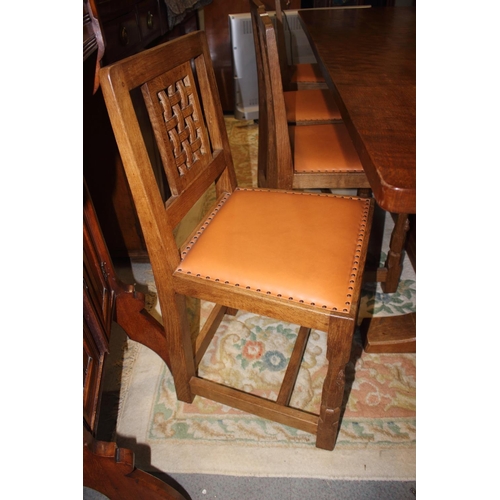 739 - A set of eight Mouseman Thompson oak lattice back standard dining chairs with leather seats, on face... 