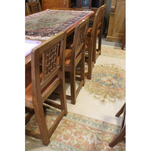 739 - A set of eight Mouseman Thompson oak lattice back standard dining chairs with leather seats, on face... 