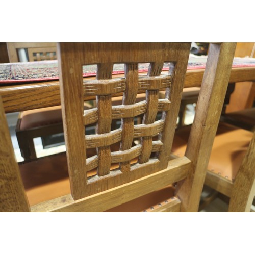 739 - A set of eight Mouseman Thompson oak lattice back standard dining chairs with leather seats, on face... 