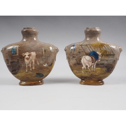 55 - A pair of painted oval porcelain panels, decorated landscapes with cows and figures, 15 3/4