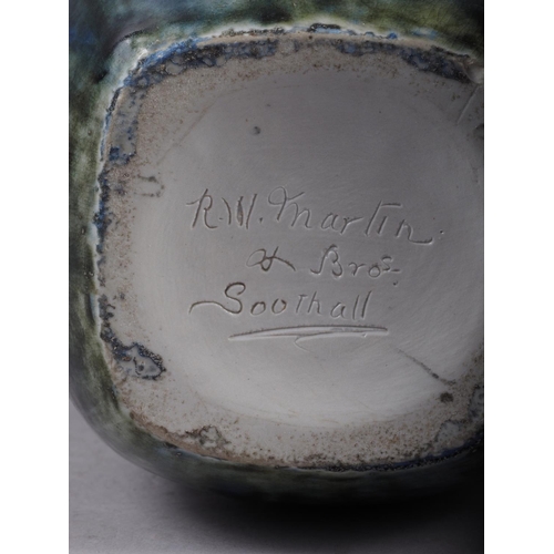 10 - A stoneware square-section vase with blue mottled glaze, inscribed 