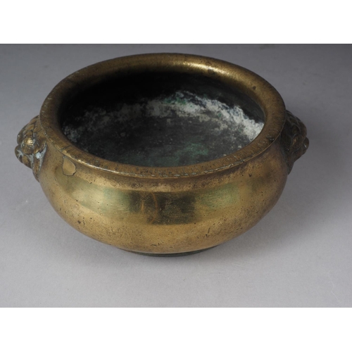 109 - A Chinese brass coloured bronze censor with handles and four character stamp mark to base, 5