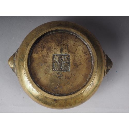 109 - A Chinese brass coloured bronze censor with handles and four character stamp mark to base, 5