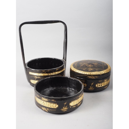 111 - A Chinese black and gilt lacquered three-tier wedding basket, 12 1/2