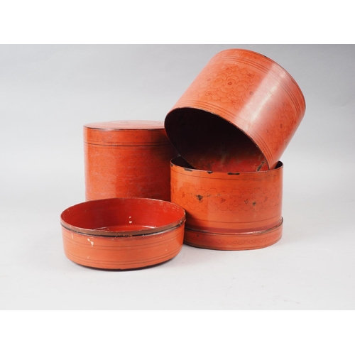 114 - A pair of cylindrical red lacquered boxes, 7 3/4