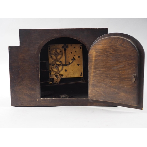 117 - An Art Deco walnut cased mantel clock with three train movement, 9