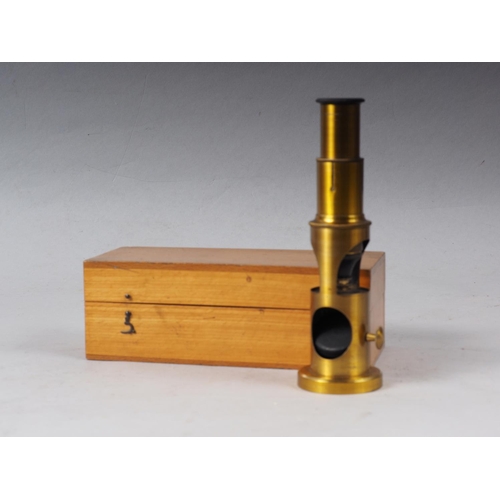 129 - A brass portable microscope, in case, with three lenses, 6 1/4