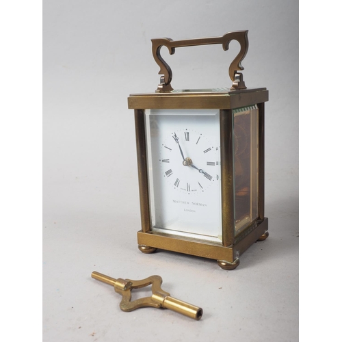 137 - A Matthew Norman brass and glass cased carriage clock, 5