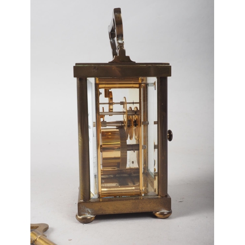 137 - A Matthew Norman brass and glass cased carriage clock, 5