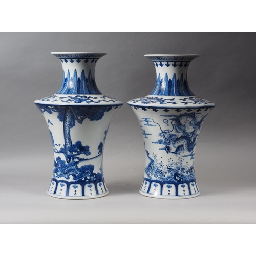 67 - A pair of Chinese blue and white flared vases with figures in a landscape decoration, 16