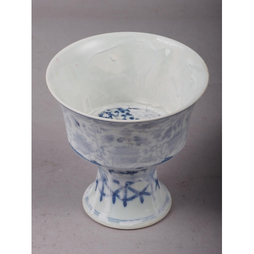 84 - A Chinese porcelain blue and white stem cup with faulty glaze, 4 1/8