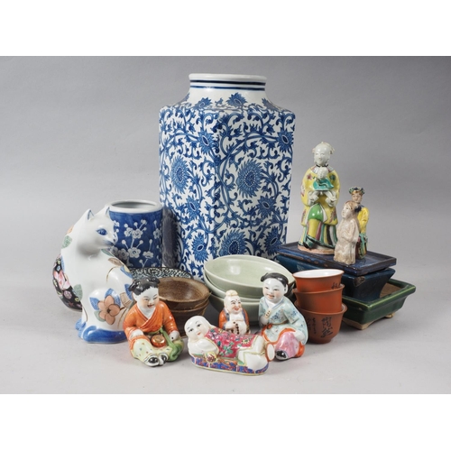 90 - A quantity of mostly Chinese figures, a blue and white brush pot, 5