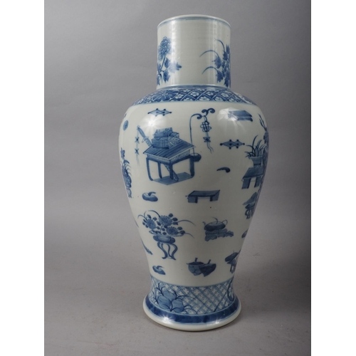 99 - A Chinese porcelain blue and white baluster vase, decorated precious objects, 16