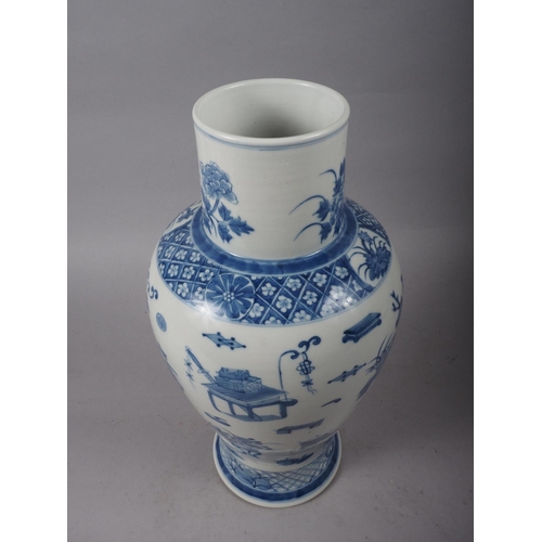 99 - A Chinese porcelain blue and white baluster vase, decorated precious objects, 16