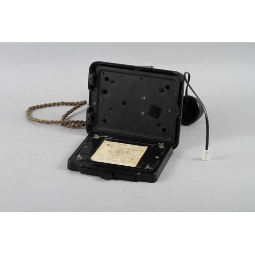 120 - A black cased rotary telephone, No 1/232