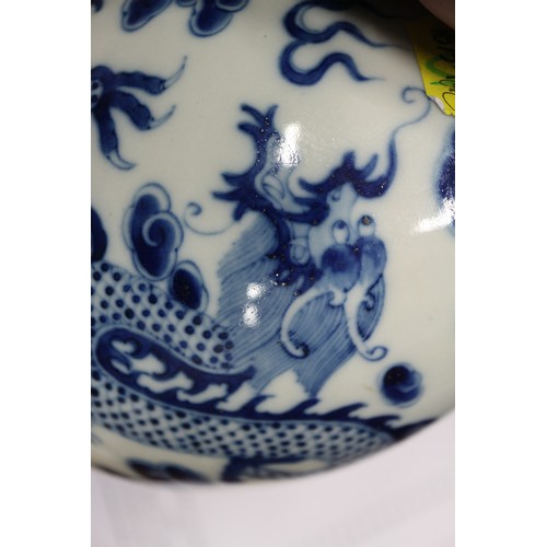 79 - A Chinese blue and white sprinkler bottle vase, decorated dragon, phoenix, clouds and scrolls, with ... 