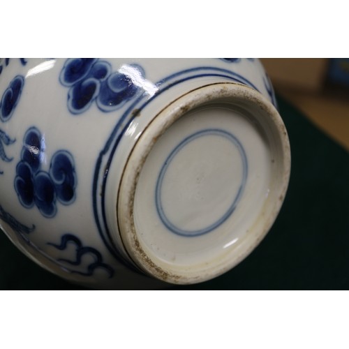 79 - A Chinese blue and white sprinkler bottle vase, decorated dragon, phoenix, clouds and scrolls, with ... 