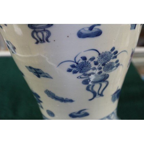 99 - A Chinese porcelain blue and white baluster vase, decorated precious objects, 16