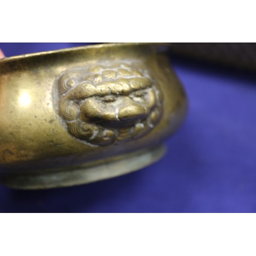 109 - A Chinese brass coloured bronze censor with handles and four character stamp mark to base, 5