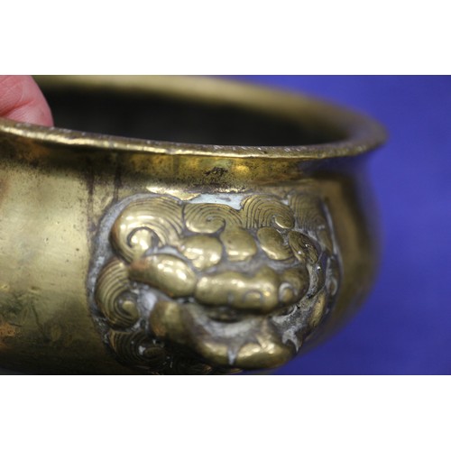 109 - A Chinese brass coloured bronze censor with handles and four character stamp mark to base, 5