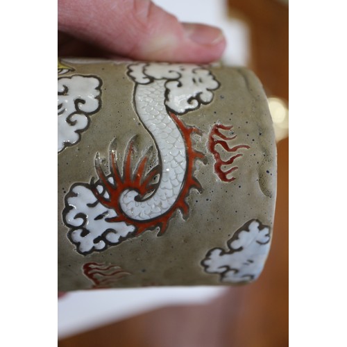 96 - A Chinese cylindrical brush pot, decorated dragon amongst clouds with flaming pearl 4 1/8