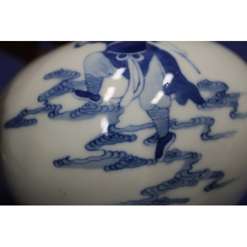 74 - A Chinese blue and white bulbous vase, decorated figures on clouds and four character mark to base, ... 